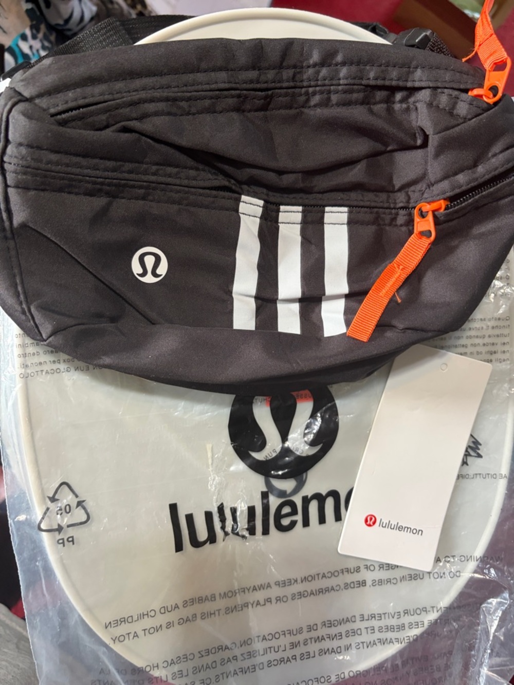 NWT- Lululemon athletica Black Waist Pack with White Stripes and Orange Zipper